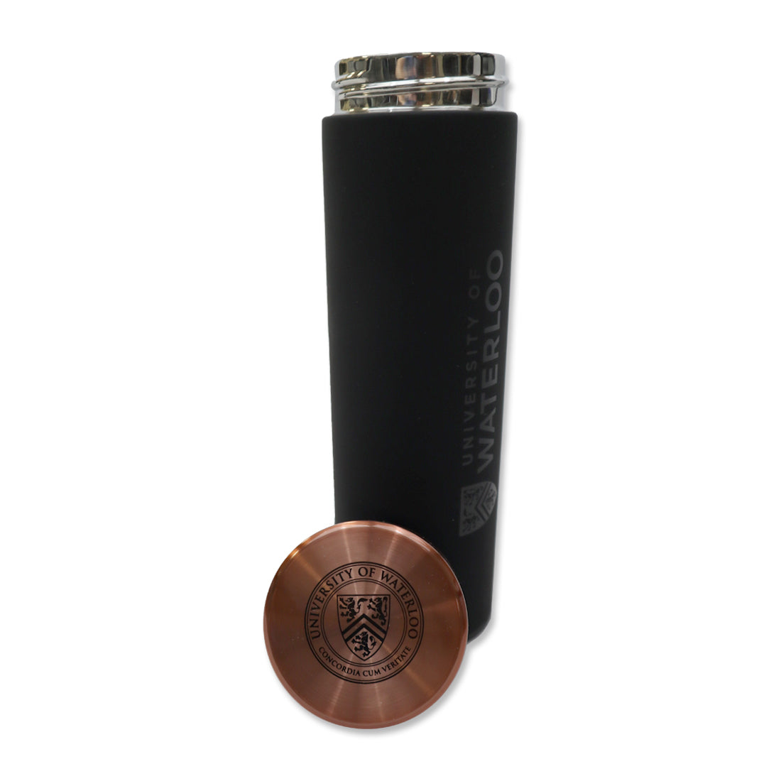 A black insulated water bottle with a silver lid, featuring the text "University of Waterloo" engraved on it, next to a copper-colored round medallion with the same university logo.
