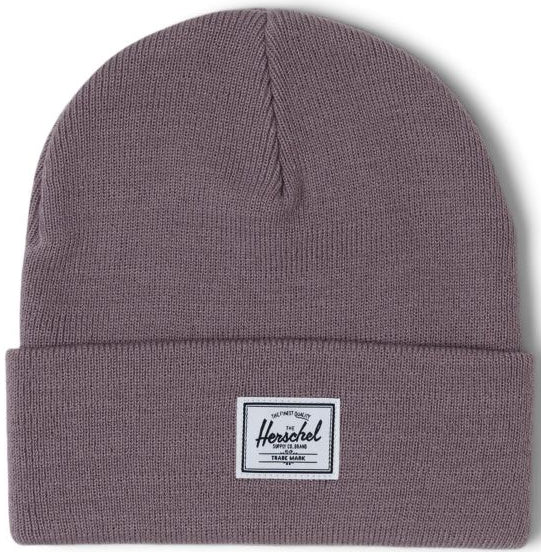 A folded gray beanie hat with a white Herschel label on the front.