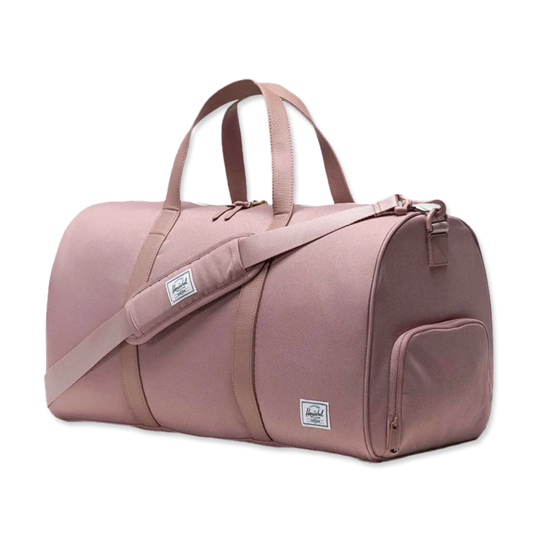 A pink duffel bag with two top handles and a shoulder strap. It features a small front pocket and a brand label on the side.