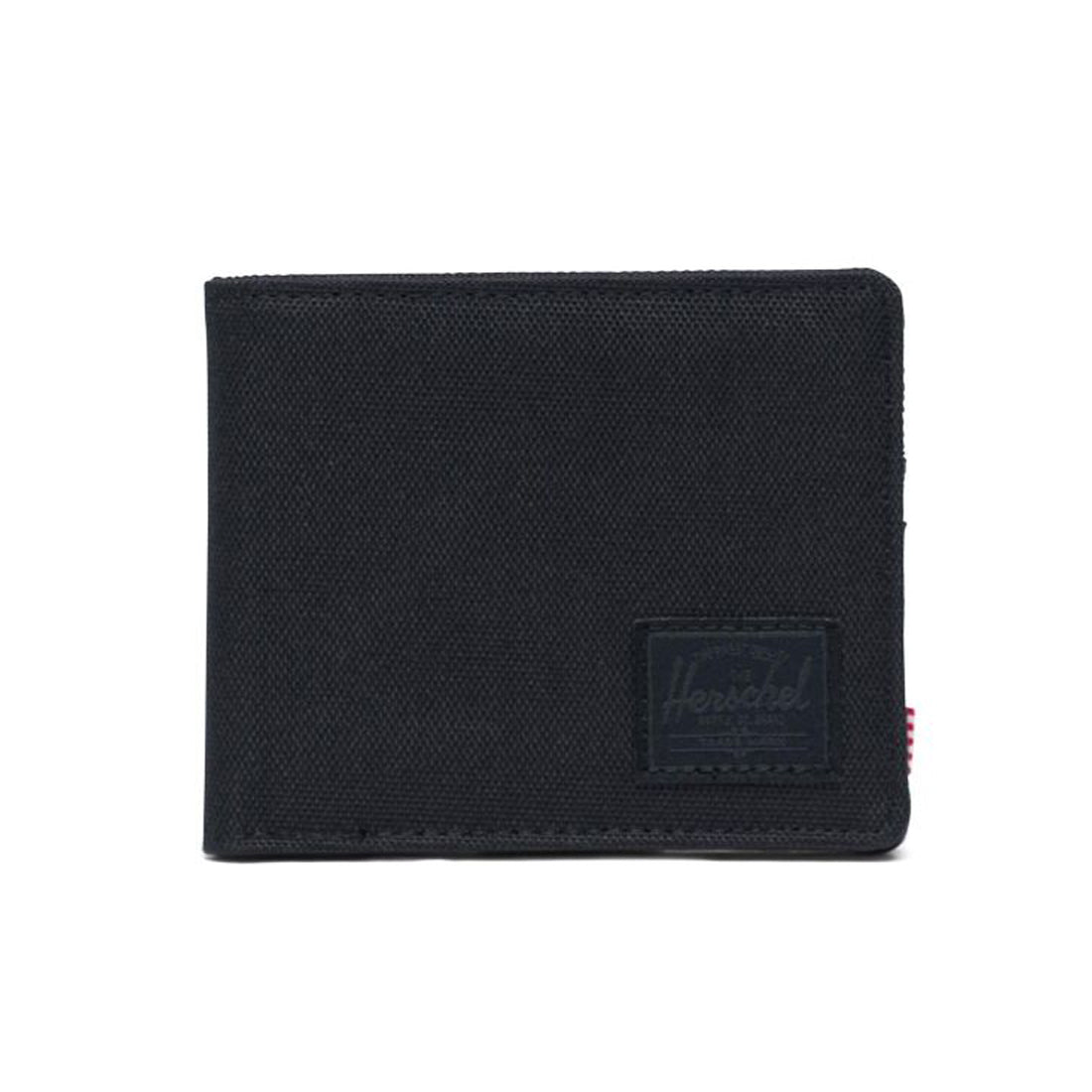 Black fabric wallet with a Herschel logo patch on the front.