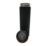 A black insulated water bottle with a metallic lid, featuring the University of Waterloo logo engraved on the side, next to a round, silver-colored coaster with the same logo.