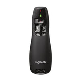 A black Logitech presentation remote with buttons for advancing and reversing slides, and a green indicator light at the top.
