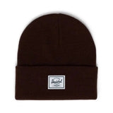 Brown knit beanie with a folded cuff and a label reading "Herschel" on the front.