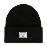 Black knit beanie with a folded cuff and a white label on the front.