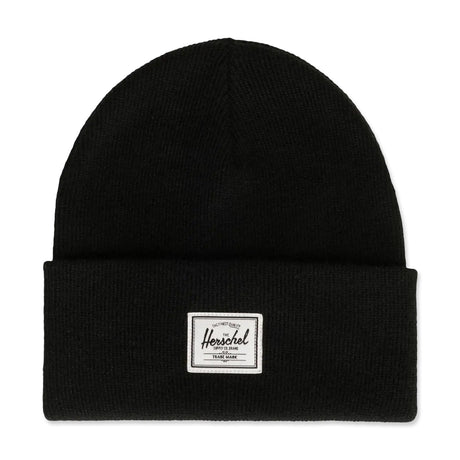 Black knit beanie with a folded cuff and a white label on the front.