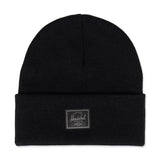 Black knit beanie with a folded cuff and a small Herschel patch on the front.