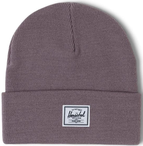 A folded gray beanie hat with a white Herschel label on the front.