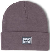 A folded gray beanie hat with a white Herschel label on the front.