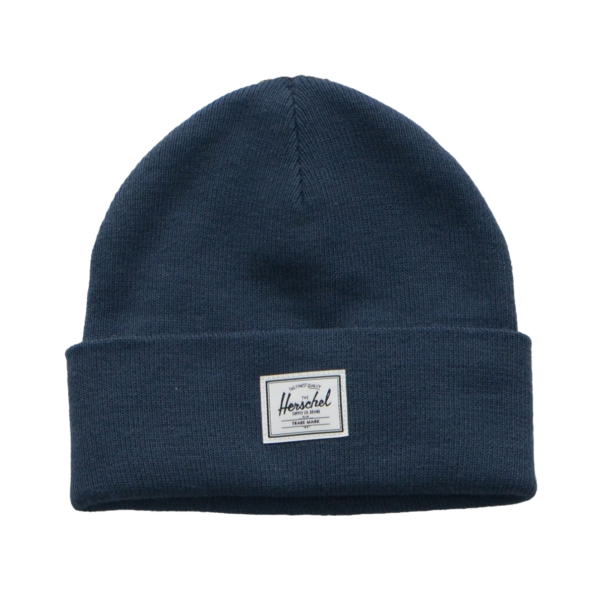 A navy blue beanie hat with a folded cuff and a white tag that reads "Herschel" on it.