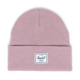 Light pink beanie hat with a folded cuff and a white Herschel label.