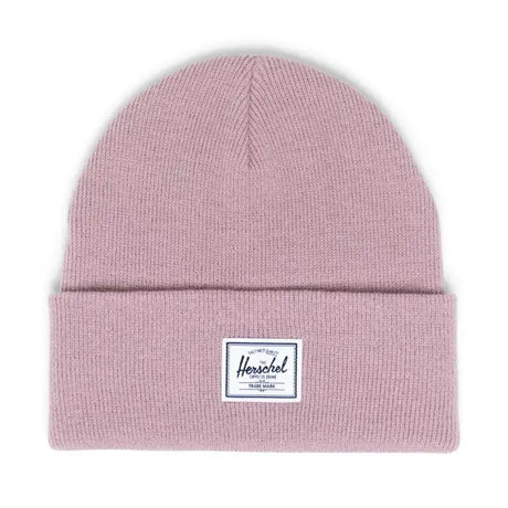 Light pink beanie hat with a folded cuff and a white Herschel label.