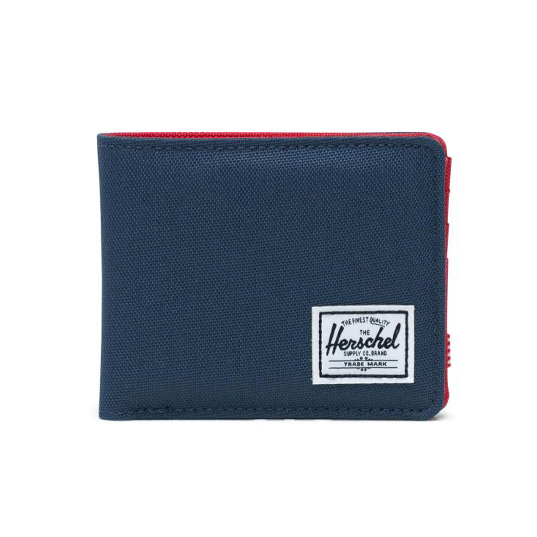 A navy blue wallet with a red zipper and a white Herschel logo patch on the front.