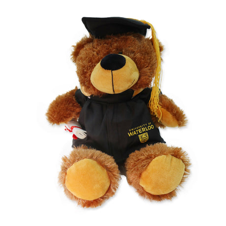 A plush bear wearing a graduation cap and gown with the University of Waterloo logo.
