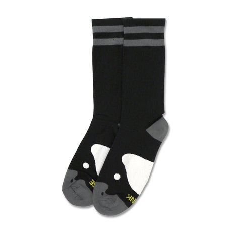 Black socks with gray stripes and a playful penguin design on the toes.