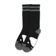 Black socks with gray stripes and a playful penguin design on the toes.