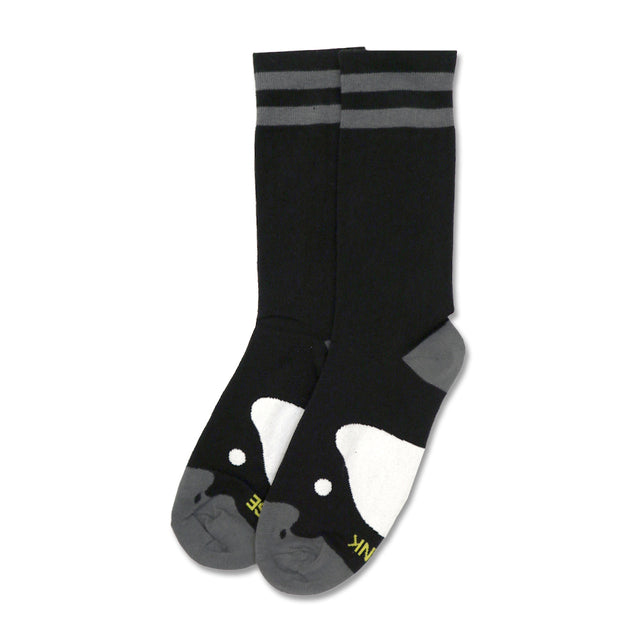Black socks with gray stripes and a playful penguin design on the toes.