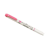 A pink double-ended highlighter with a white body labeled "MILDLINER."