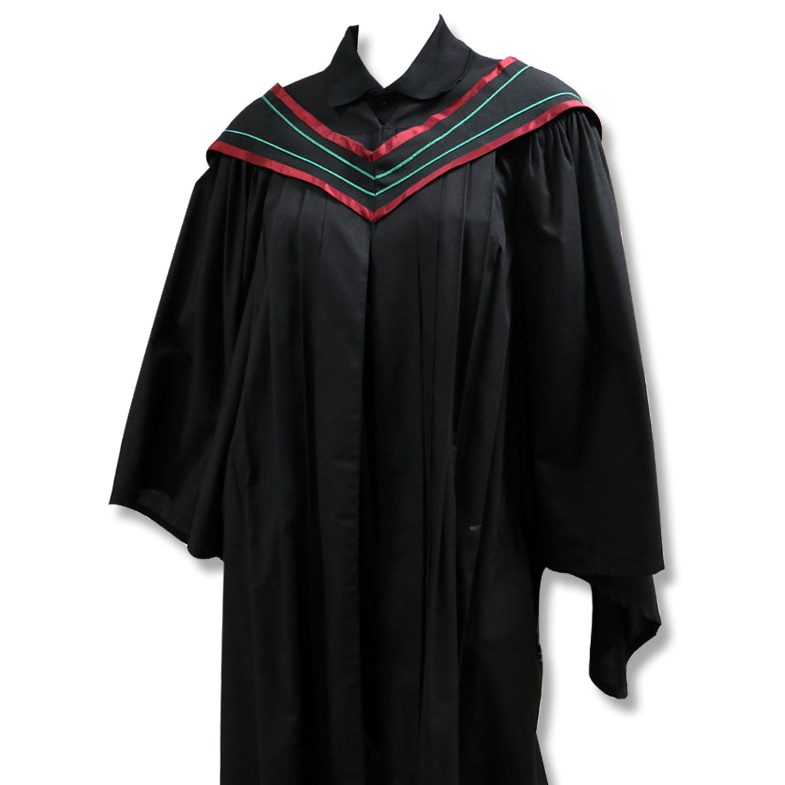 Black graduation gown with a red and green V-shaped yoke trim.