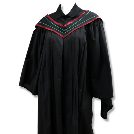 Black graduation gown with a red and green V-shaped yoke trim.
