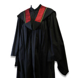 Black graduation gown with a red and gold-trimmed collar.