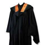 A black graduation gown with an orange and teal collar.