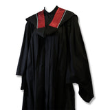 Black graduation gown with a red and white collar.