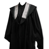 Black graduation gown with a wide, silver-trimmed collar.