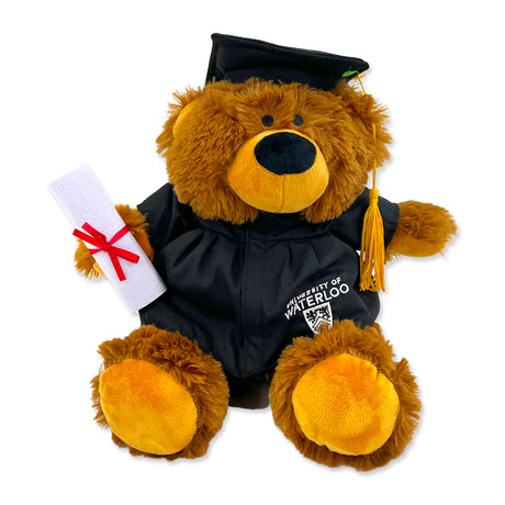 A brown teddy bear wearing a black graduation gown and cap with a yellow tassel, featuring the "University of Waterloo" logo.