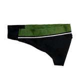 A black and green fabric piece with a decorative silver trim, resembling a stylized collar or headband.