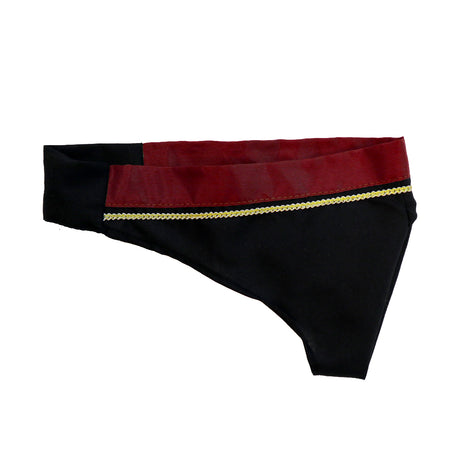 A black fabric piece with a red and gold-accented border, resembling part of traditional attire.