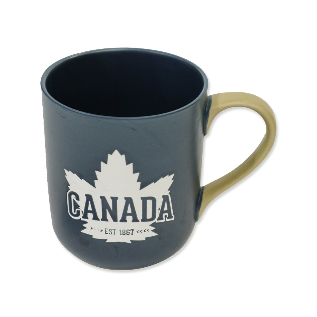 A navy blue ceramic mug with a beige handle, featuring a white maple leaf and the word "CANADA" along with "EST 1867" printed on the front.