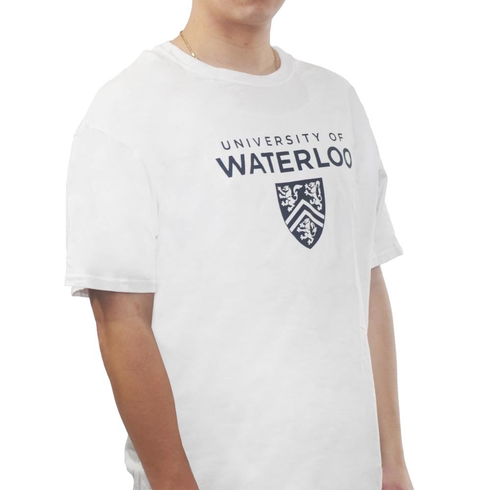 A person wearing a white t-shirt with "University of Waterloo" printed in navy blue and a coat of arms design below the text.