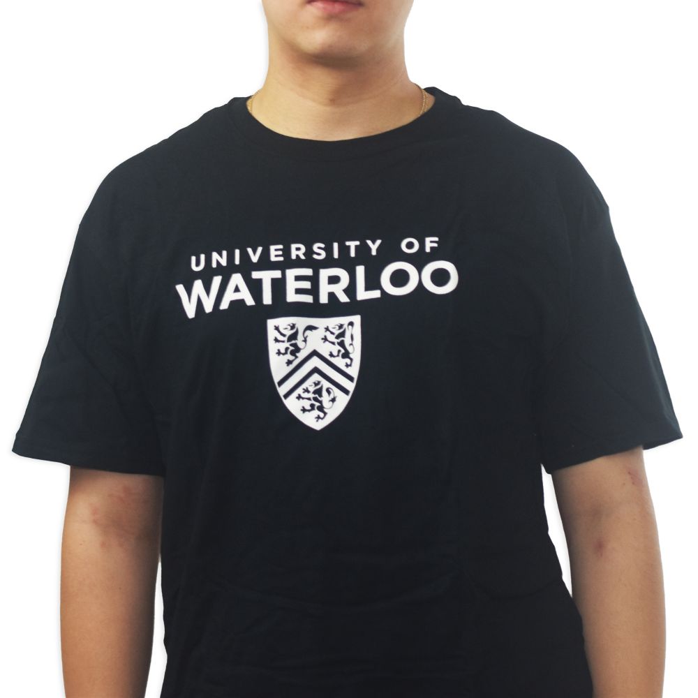 A person wearing a black t-shirt with the words "University of Waterloo" and a shield logo printed in white.